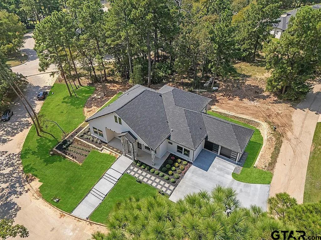 4504 Triggs Trace Tyler, TX 75709 - Photo 10 of 46 an aerial view of a house with a garden and trees
