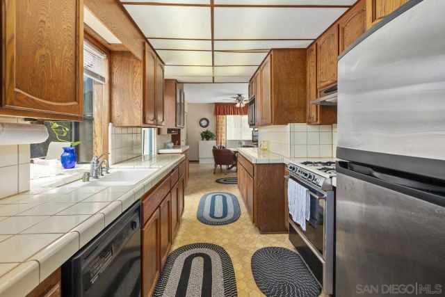 a kitchen with a stove and a sink