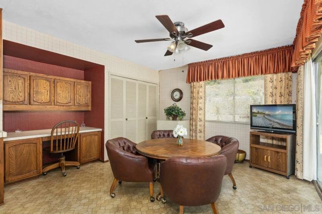 a dining room with furniture and window