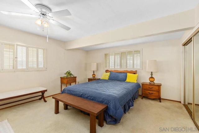 a bedroom with a bed and a table in it