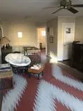 a view of a livingroom with furniture and a fireplace