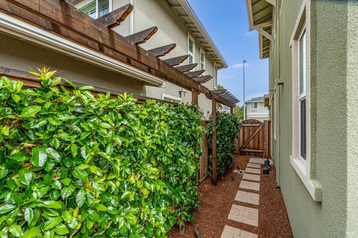 349 Vinterra Court Napa, CA 94559 - Photo 40 of 53 On either side of the home the owners created lush greenery to look at rather than the fence line