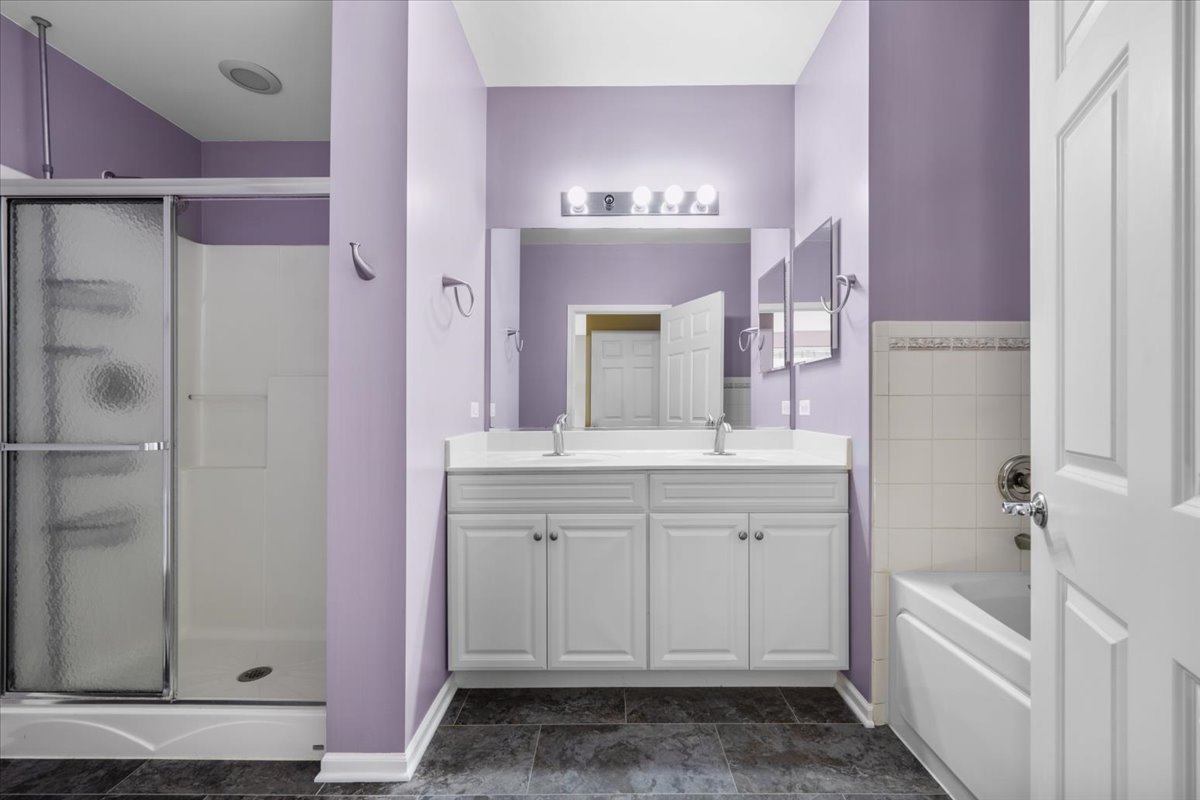 371 Ridge Road North Aurora, IL 60542 - Photo 13 of 21 a spacious bathroom with a granite countertop sink and a mirror