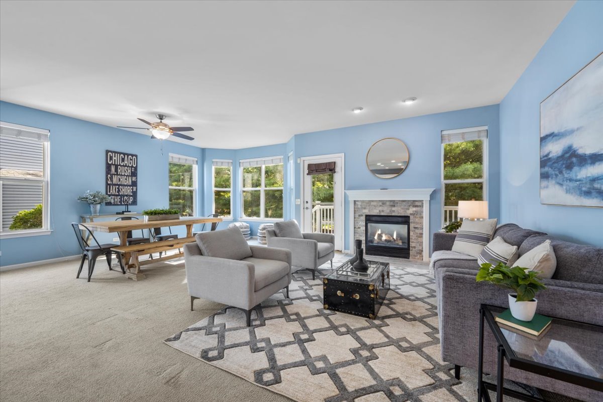 371 Ridge Road North Aurora, IL 60542 - Photo 6 of 21 a living room with furniture a fireplace and a large window