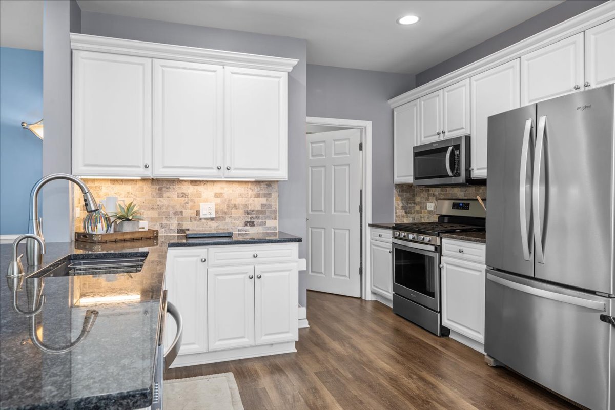 371 Ridge Road North Aurora, IL 60542 - Photo 9 of 21 a kitchen with granite countertop stainless steel appliances a sink and cabinets
