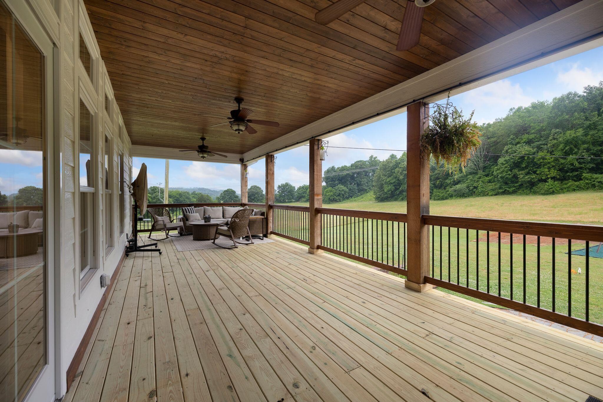 6866 Daus Mountain Road Whitwell, TN 37397 - Photo 35 of 49 a view of a patio with wooden floor