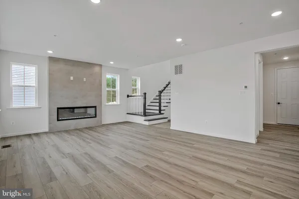 a kitchen with granite countertop a sink and cabinets