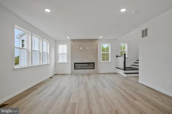 a kitchen with stainless steel appliances white cabinets and stove