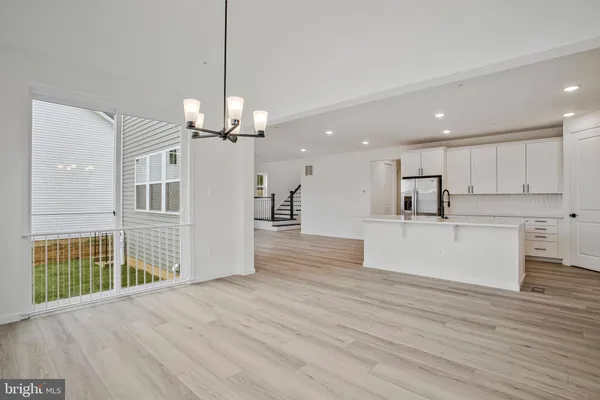 a view of room with wooden floor