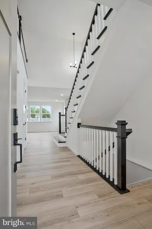a view of kitchen with furniture and wooden floor