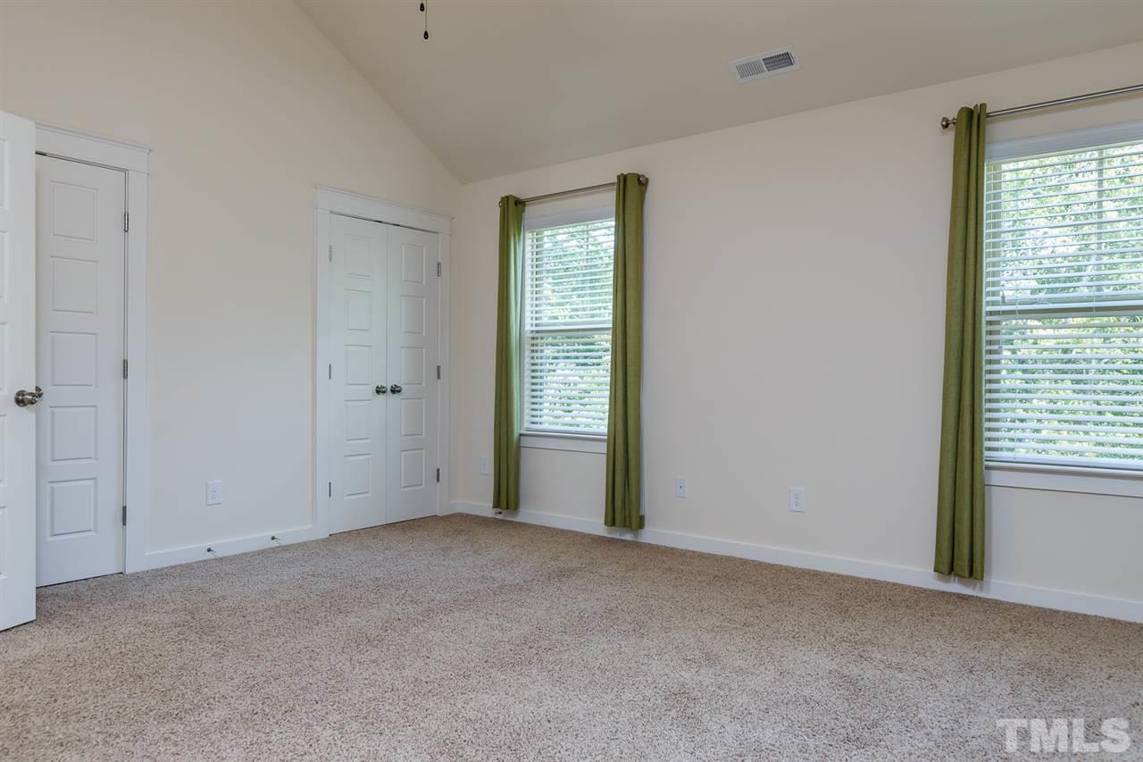 7841 Allscott Way Raleigh, NC 27612 - Photo 9 of 20 a view of an empty room with a window