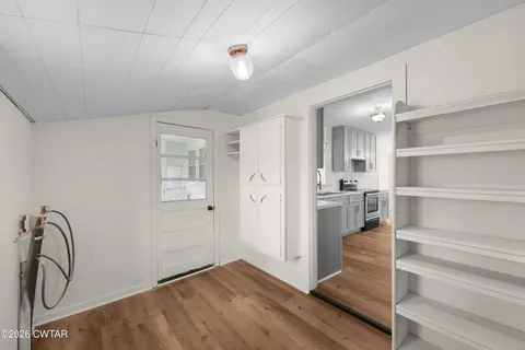 a view of a room with a large window