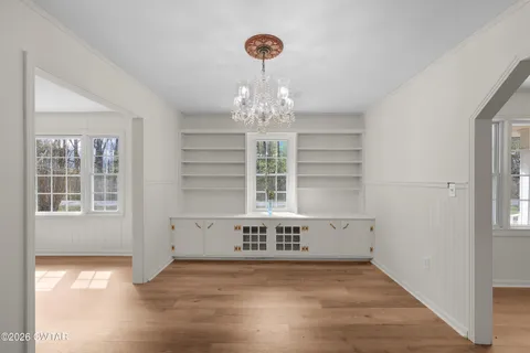 a kitchen with white cabinets stainless steel appliances and a counter top