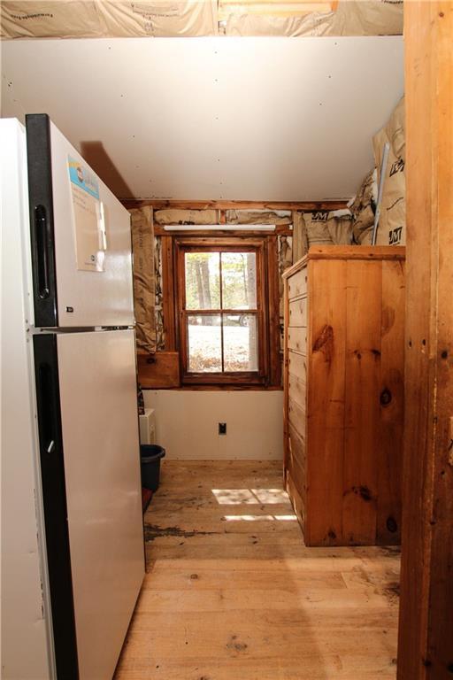 191 Toothaker Pond Road Phillips, ME 04966 - Photo 13 of 30 Refrigerator and small storage area...