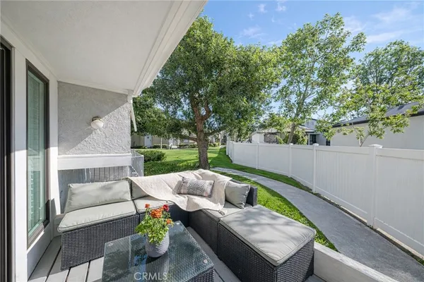 a spacious bedroom with a bed and a window
