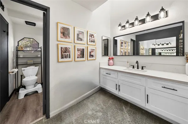 a bathroom with a double vanity sink and a mirror