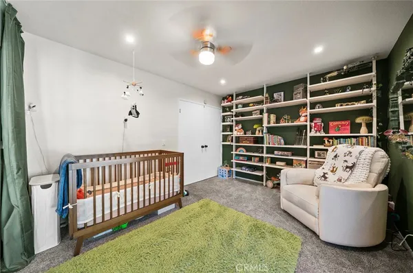 a view of house with a yard and sitting area