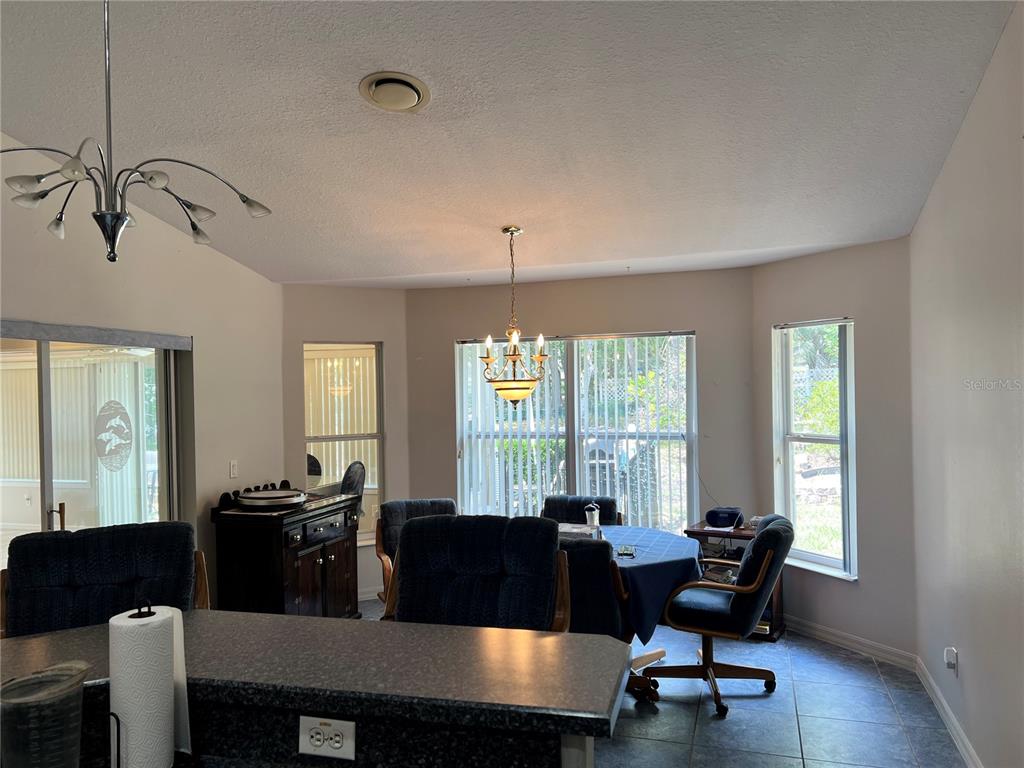 1995 East Newhaven Street Inverness, FL 34453 - Photo 47 of 48 a view of a dining room with furniture and window