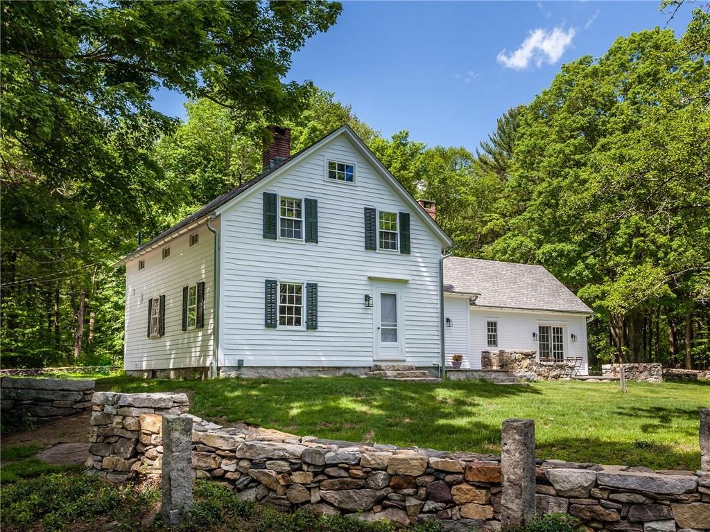 272 Milton Road Litchfield, CT 06759 - Photo 1 of 1 a front view of a house with a yard