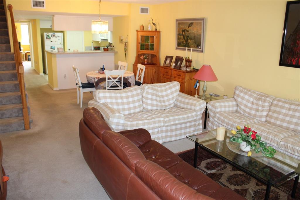 9722 Indian Key Trail, Unit 116 Seminole, FL 33776 - Photo 17 of 65 a living room with furniture
