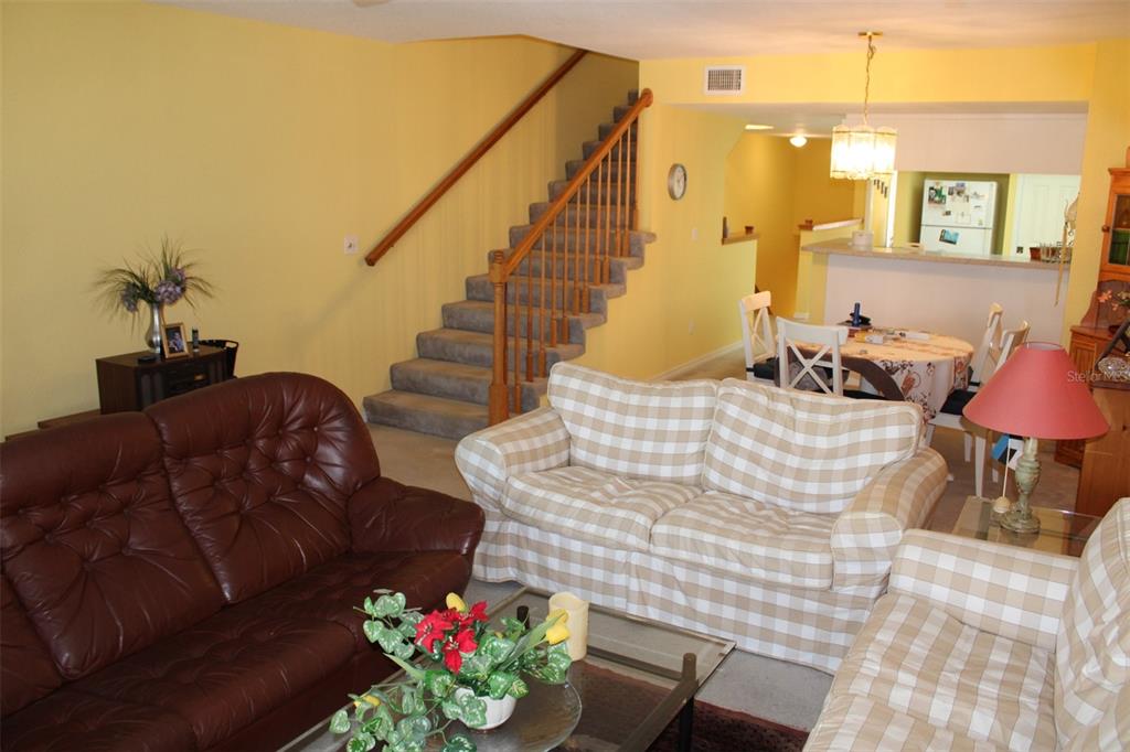 9722 Indian Key Trail, Unit 116 Seminole, FL 33776 - Photo 18 of 65 a living room with furniture