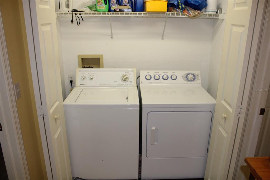 9722 Indian Key Trail, Unit 116 Seminole, FL 33776 - Photo 21 of 65 a utility room with dryer and washer