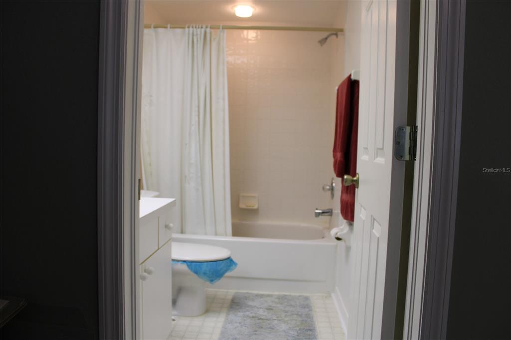 9722 Indian Key Trail, Unit 116 Seminole, FL 33776 - Photo 24 of 65 a bathroom with a shower and a bath tub