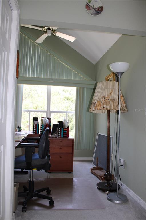 9722 Indian Key Trail, Unit 116 Seminole, FL 33776 - Photo 27 of 65 a view of a livingroom with furniture and a window