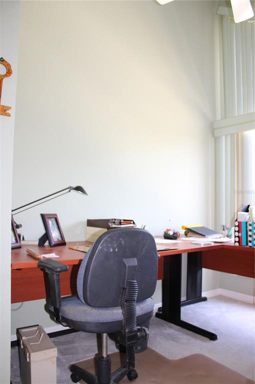 9722 Indian Key Trail, Unit 116 Seminole, FL 33776 - Photo 28 of 65 a workspace with furniture and window