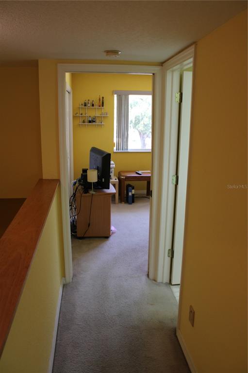 9722 Indian Key Trail, Unit 116 Seminole, FL 33776 - Photo 4 of 65 a living room with furniture and a window