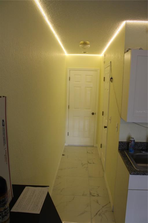 9722 Indian Key Trail, Unit 116 Seminole, FL 33776 - Photo 42 of 65 a bathroom with a shower and a sink