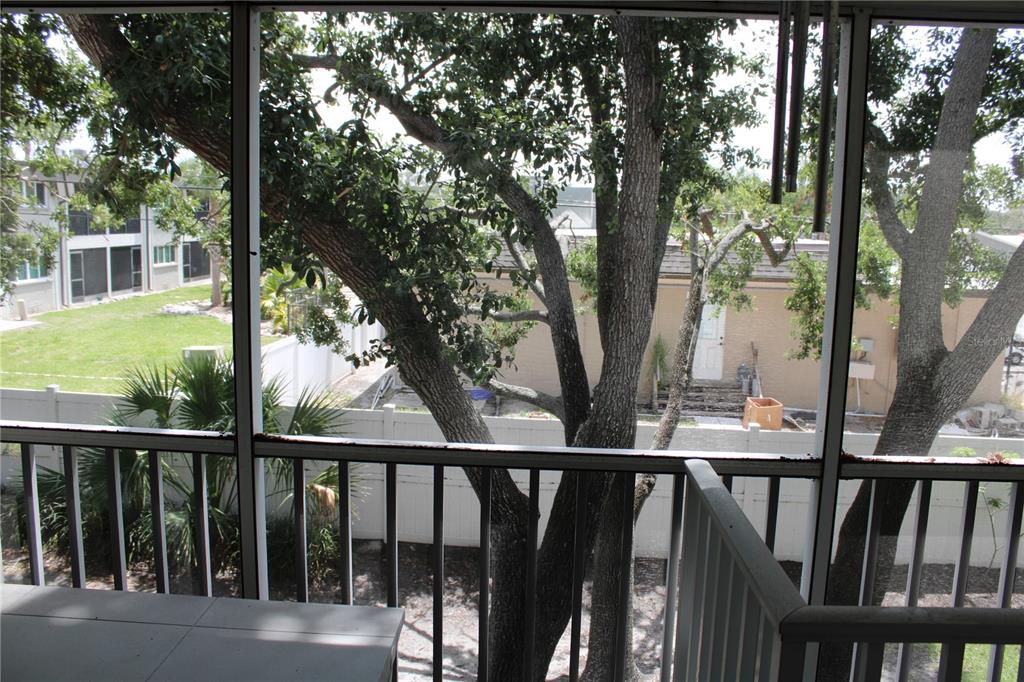 9722 Indian Key Trail, Unit 116 Seminole, FL 33776 - Photo 48 of 65 a view of a balcony with wooden fence
