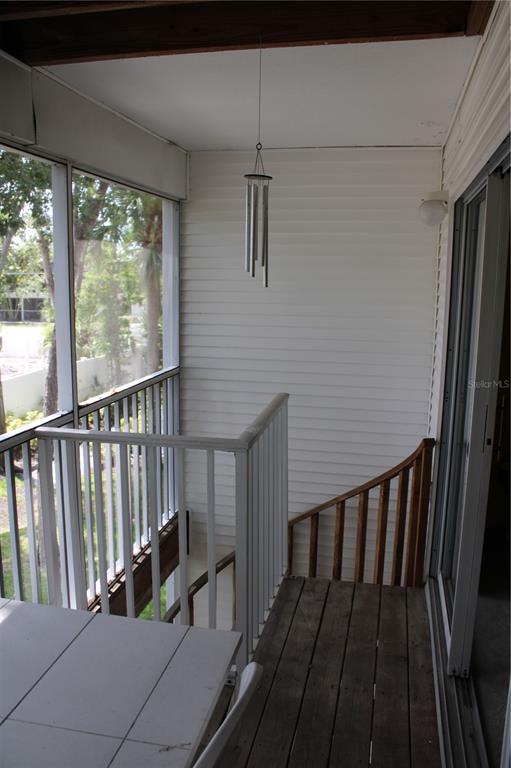 9722 Indian Key Trail, Unit 116 Seminole, FL 33776 - Photo 50 of 65 a view of balcony with wooden floor