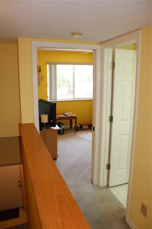 9722 Indian Key Trail, Unit 116 Seminole, FL 33776 - Photo 5 of 65 a living room with furniture and a window