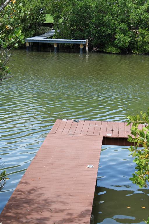 9722 Indian Key Trail, Unit 116 Seminole, FL 33776 - Photo 60 of 65 a view of a lake with a floor