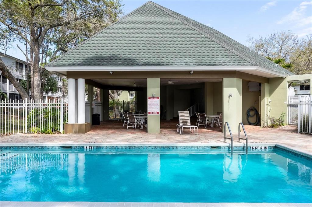 9722 Indian Key Trail, Unit 116 Seminole, FL 33776 - Photo 61 of 65 a house view with a garden space