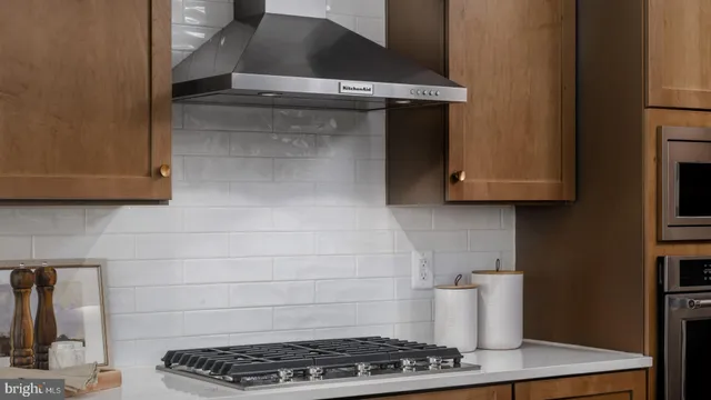 a kitchen with a stove and a microwave