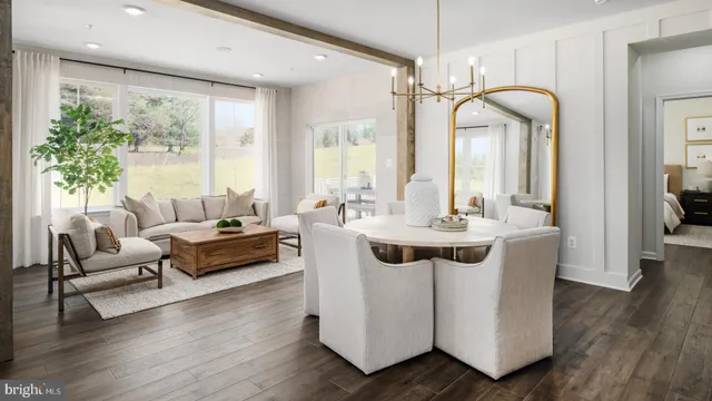 a view of living room with furniture and wooden floor