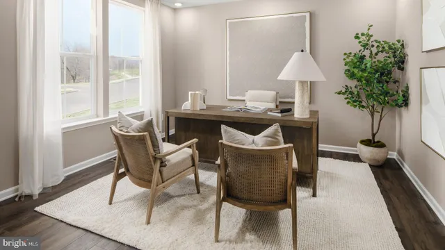 a view of a dining room with furniture and window