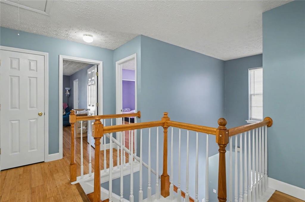 151 Ilex Drive Canton, GA 30114 - Photo 28 of 43 a view of front door with wooden floor and stairs