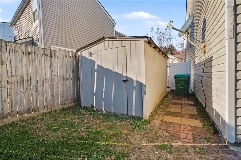 151 Ilex Drive Canton, GA 30114 - Photo 41 of 43 a view of a pathway of a house with wooden walls
