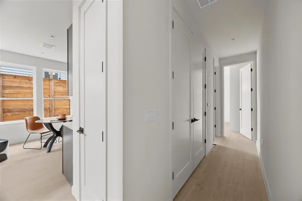 a view of a livingroom with furniture and an empty room