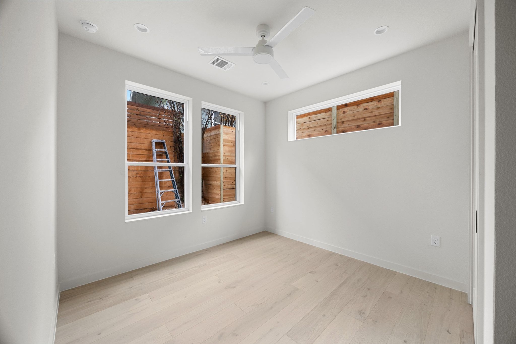 1709 Maple Avenue, Unit 2B Austin, TX 78702 - Photo 14 of 28 an empty room with windows