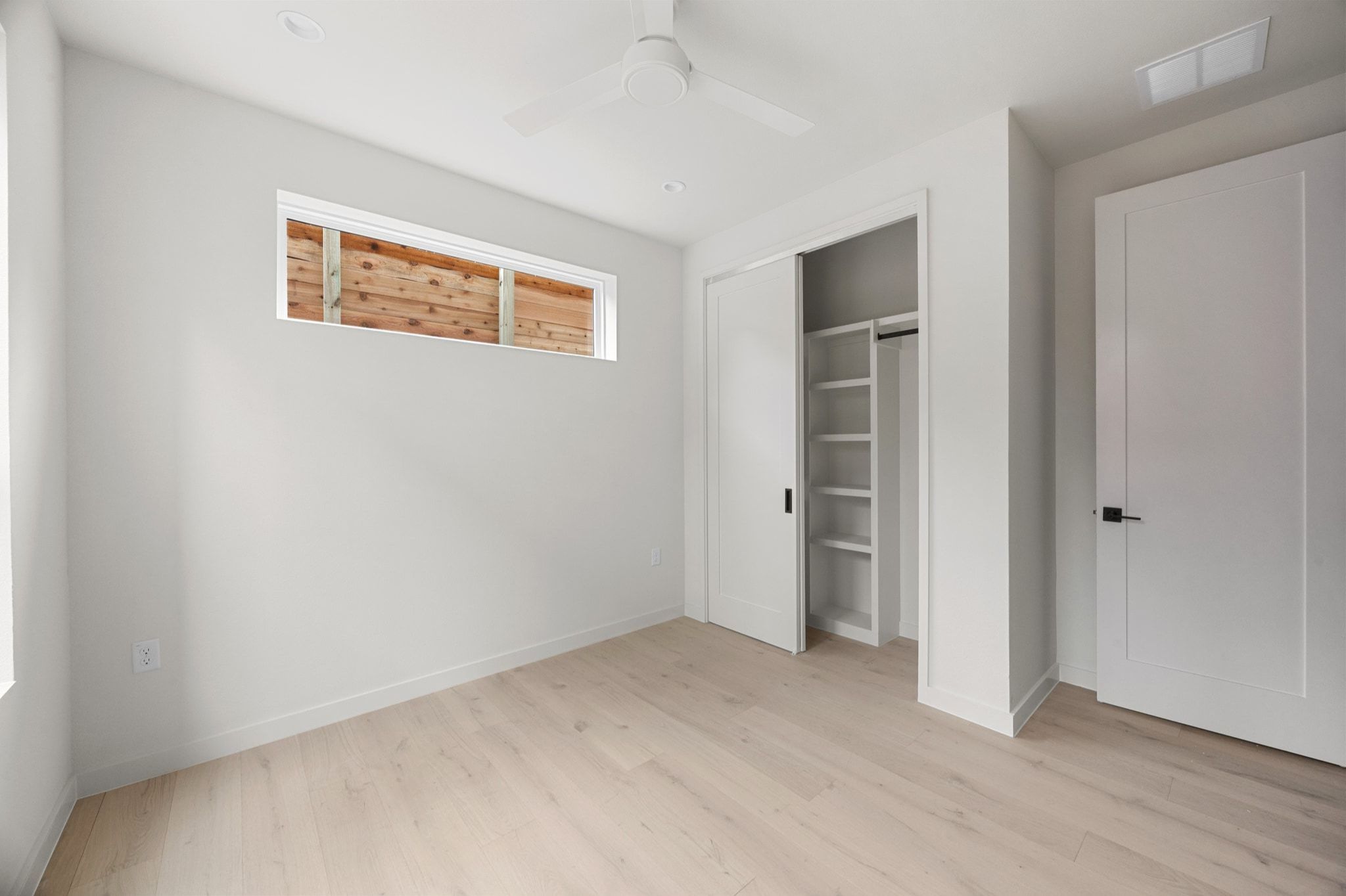 1709 Maple Avenue, Unit 2B Austin, TX 78702 - Photo 15 of 28 a view of an empty room with wooden floor and closet