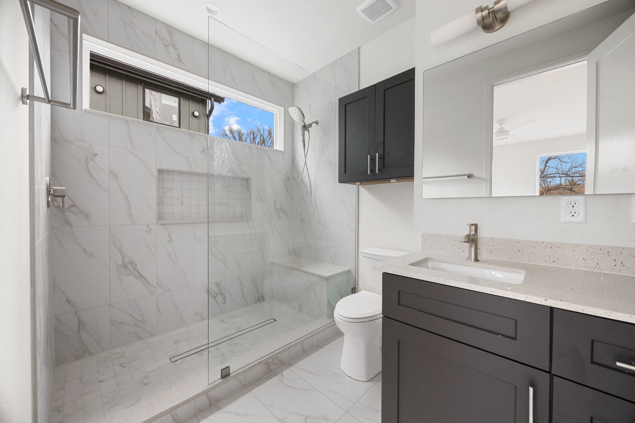 1709 Maple Avenue, Unit 2B Austin, TX 78702 - Photo 21 of 28 a bathroom with a sink toilet and shower