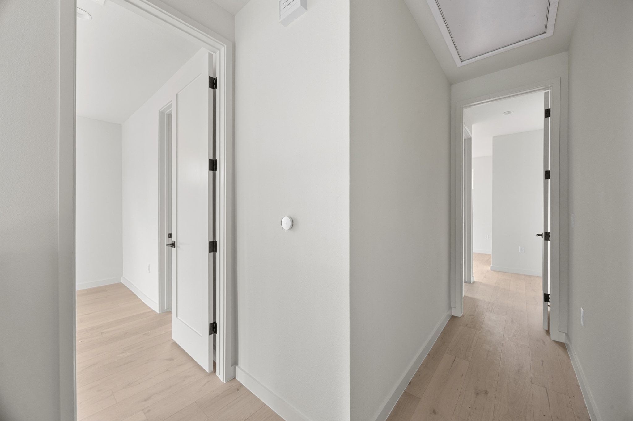 1709 Maple Avenue, Unit 2B Austin, TX 78702 - Photo 22 of 28 a view of a hallway with wooden floor