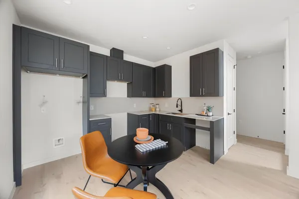 a kitchen with a sink cabinets and window
