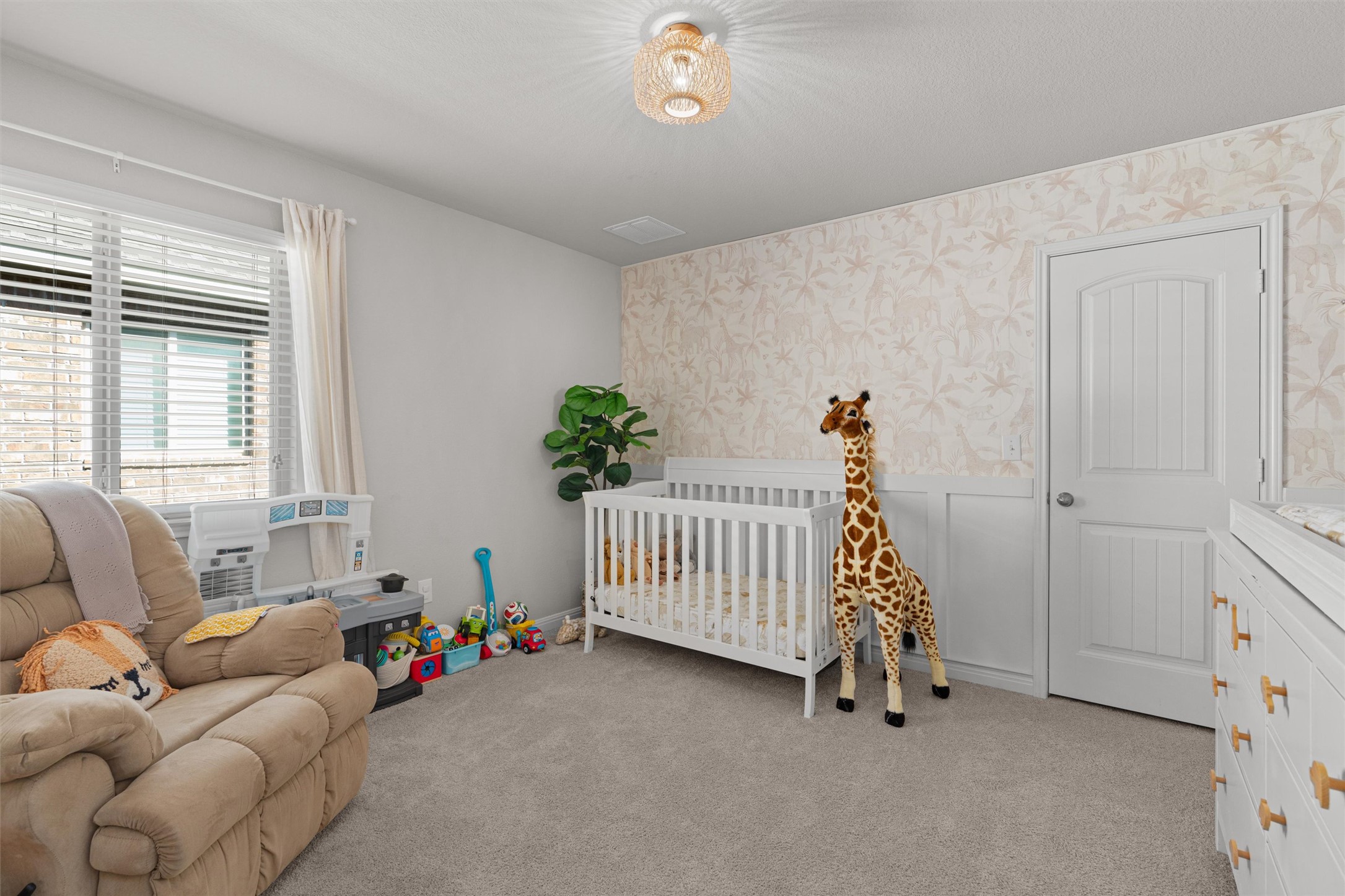 524 Longhorn Cavern Road Leander, TX 78641 - Photo 23 of 34 Bedroom with wallpapered wall