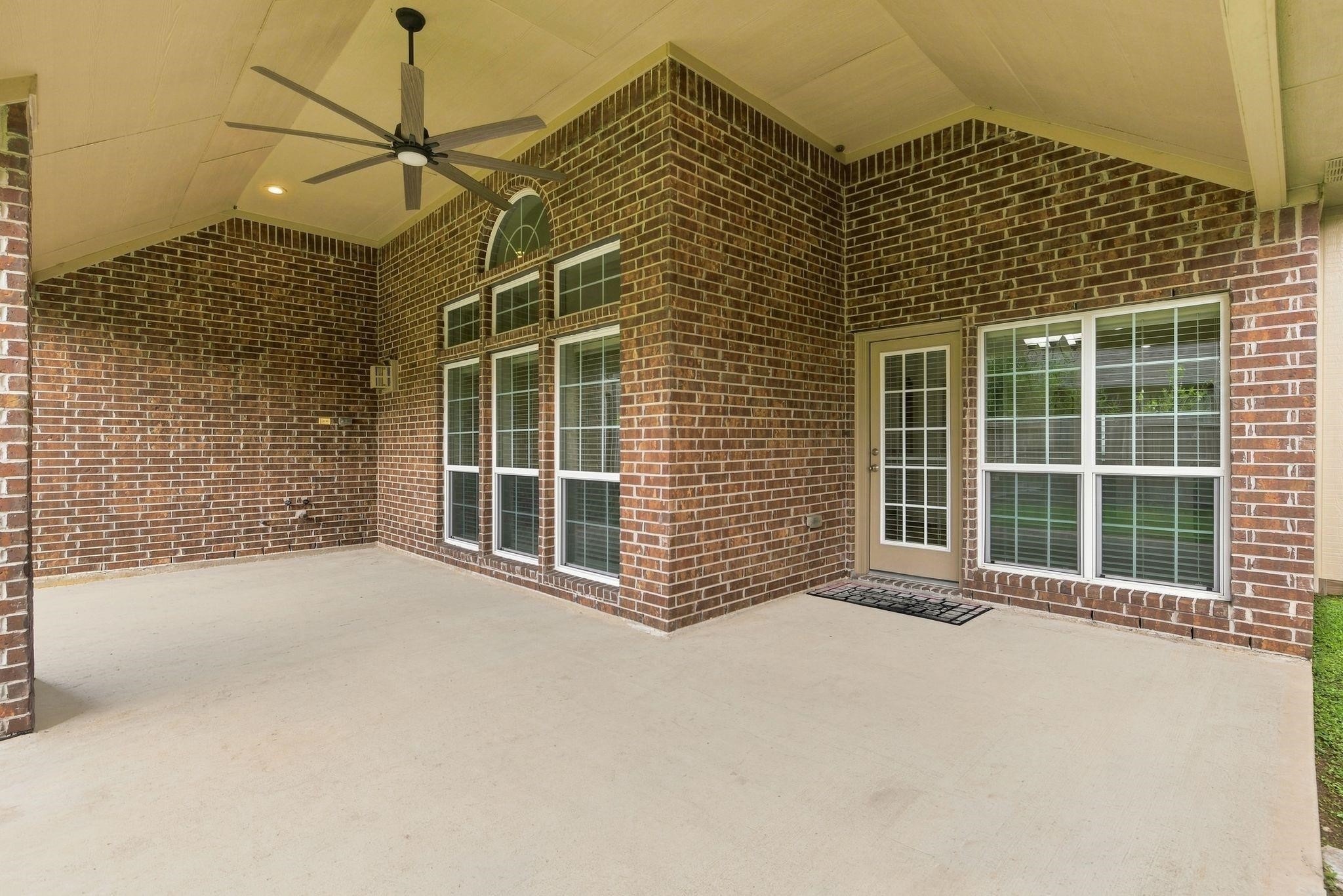 19903 Senterra Lakes Boulevard Spring, TX 77379 - Photo 48 of 50 Oversized covered patio perfect for outdoor relaxation and entertaining.
