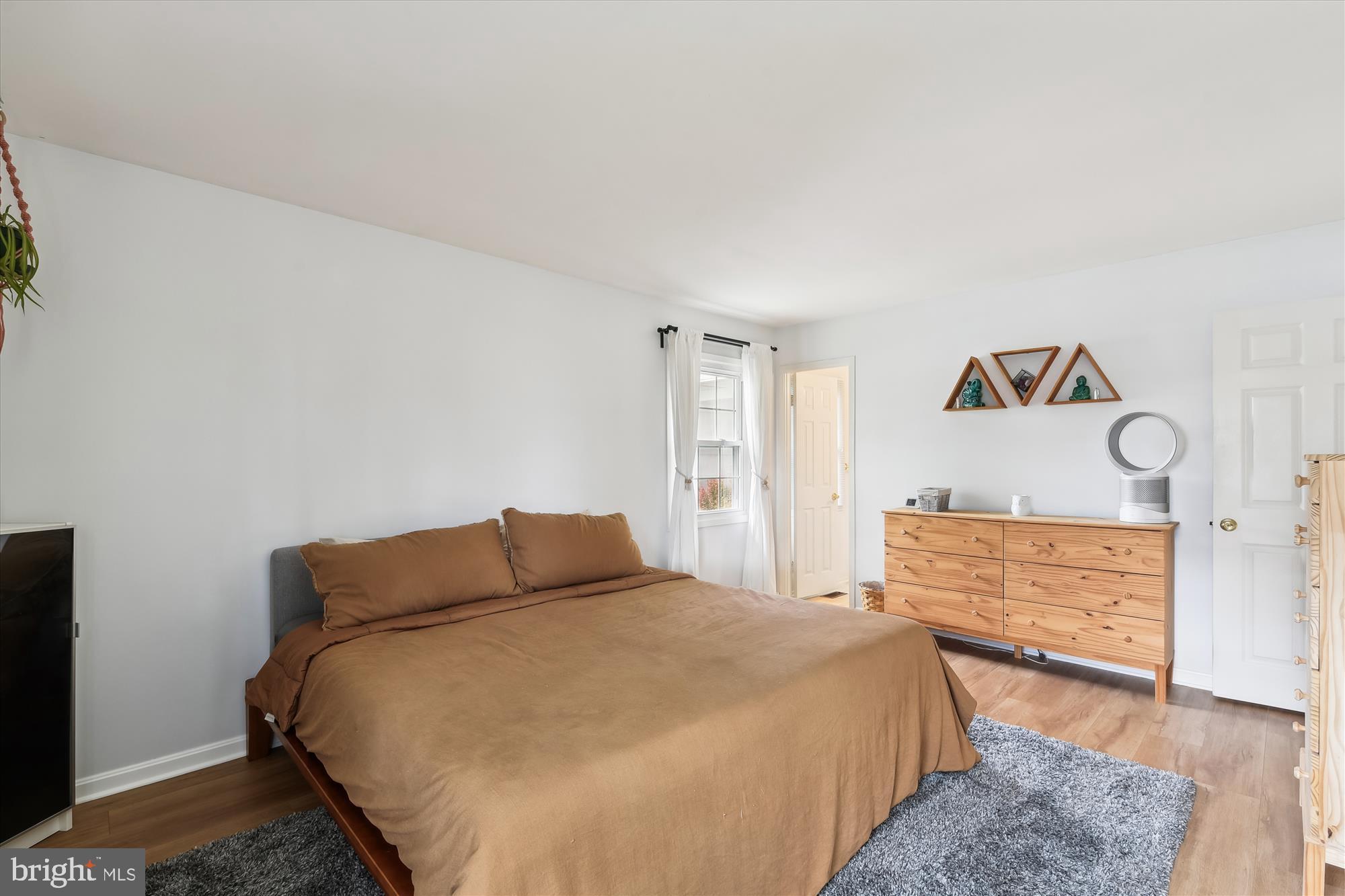 421 Haverhill Road Joppa, MD 21085 - Photo 18 of 32 a bedroom with a bed and wooden floor